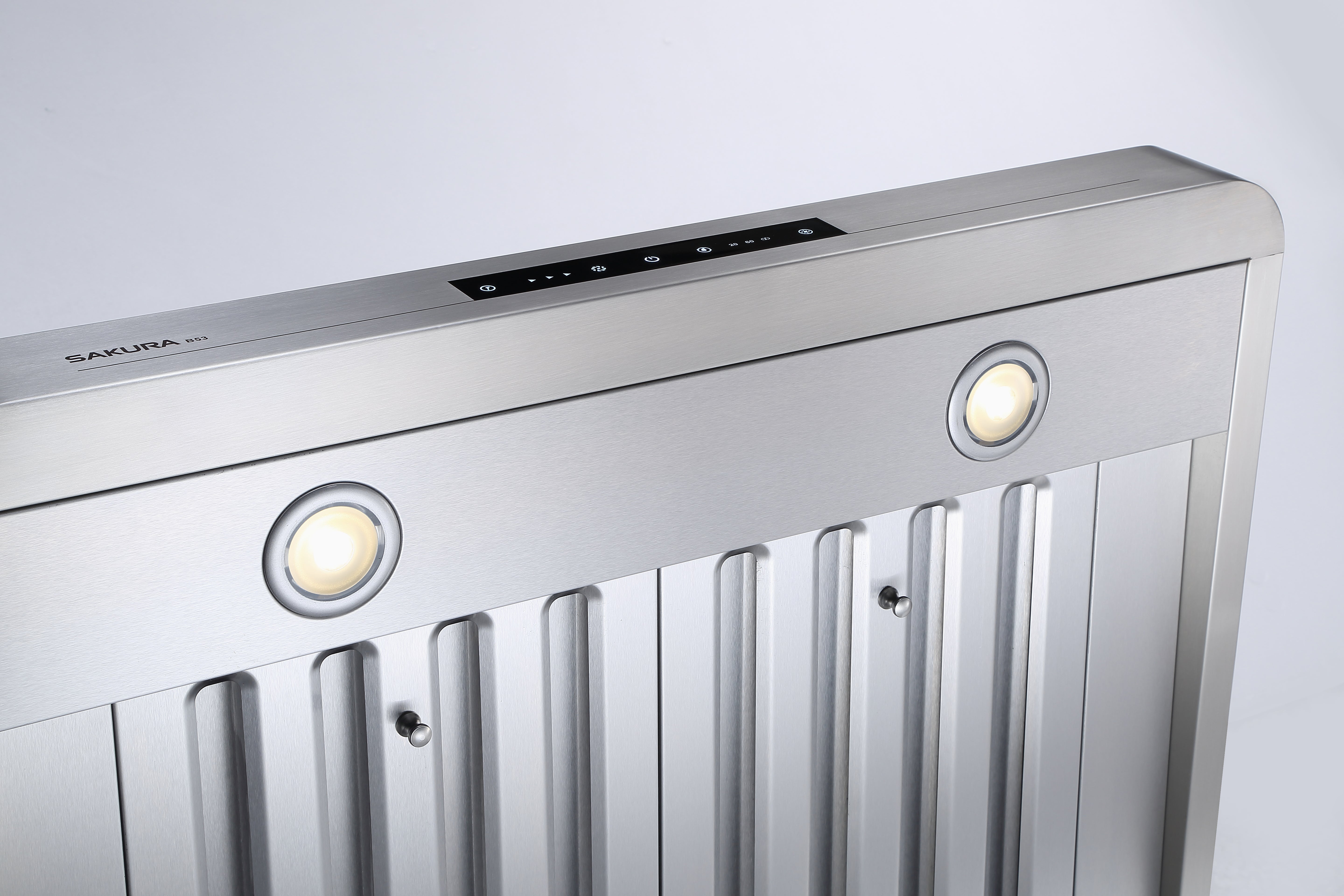 Close-up of SAKURA range hood energy-saving LED lights enhancing the cooking illumination zone