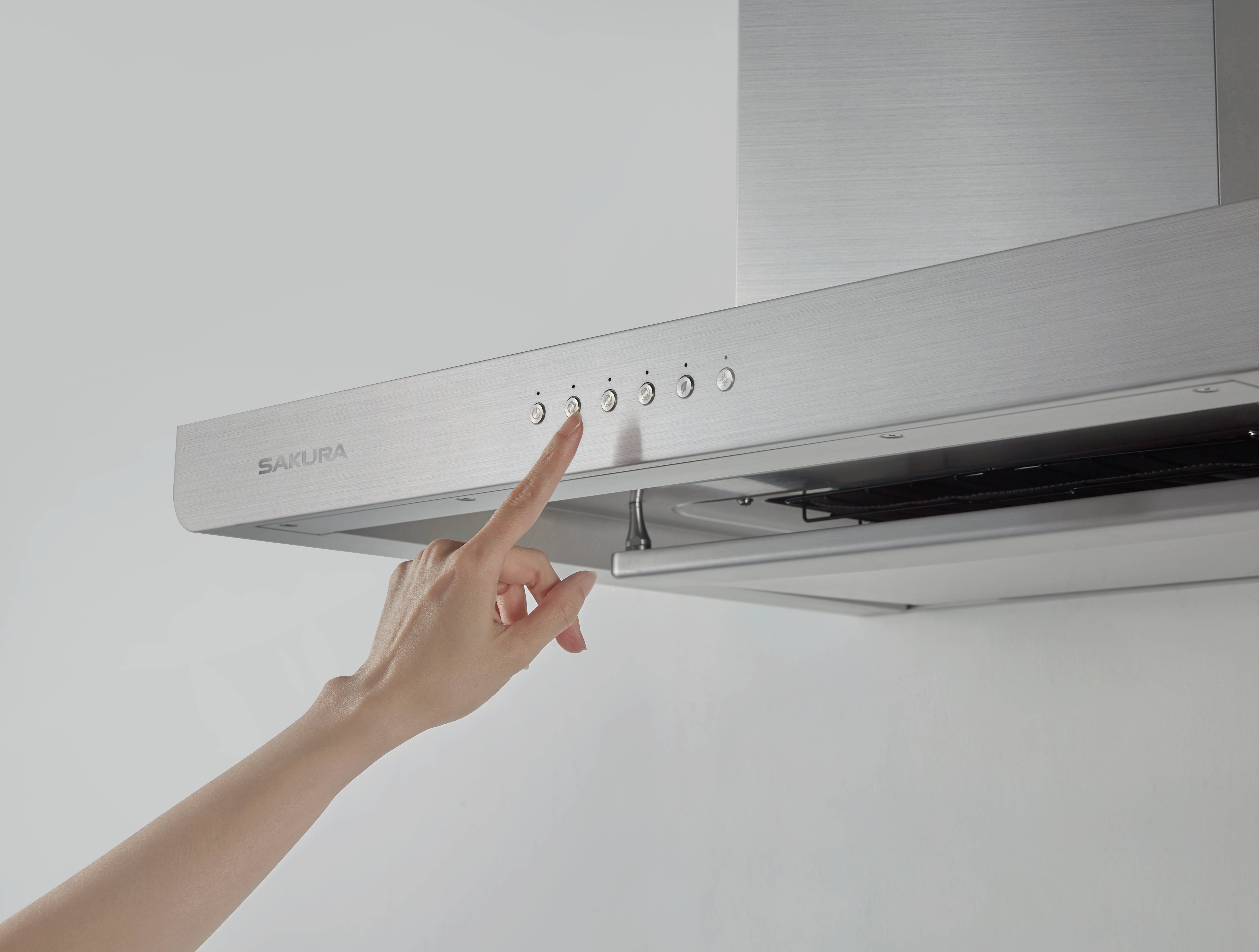Close-up of premium push buttons on SAKURA M6000 range hood for effortless daily operation